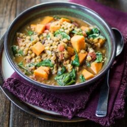 Creamy Vegan Ethiopian Lentils | Savory sweet potato, tender lentils, and fresh spinach are simmered in a Berbere-spiced coconut milk broth.This is one of my all-time favorites for cold weather and lazy weekends. I love to save the leftovers in mason jars for easy lunches during the week!