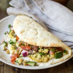 Vegan Pita Sandwiches: made with zaatar roasted cauliflower, Jerusalem salad, and an easy tahini sauce. The perfect vegan lunch!