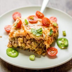 For a meatless alternative to traditional enchiladas, whip up this easy and delicious vegetarian Lentil Enchilada Casserole recipe!