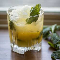 Tart lemons and fresh mint are muddled with sugar to form the base of this classic Whiskey Smash. Think you don't like whiskey? Think again!